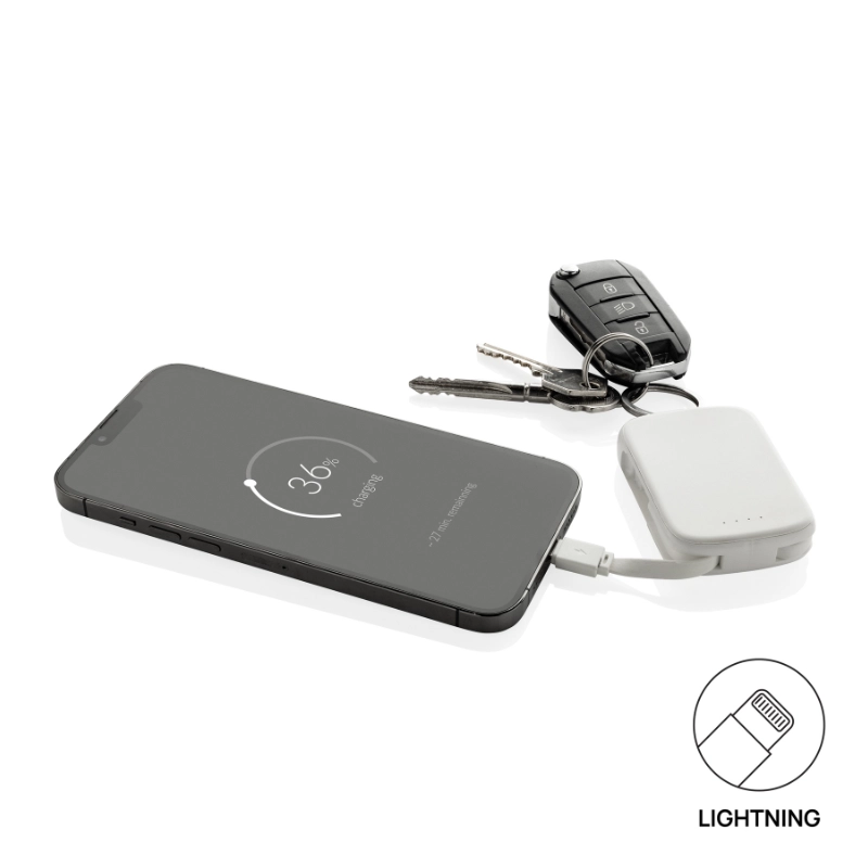 Portachiavi powerbank ecologico Nexo RCS collegato a uno smartphone tramite cavo Lightning integrato.